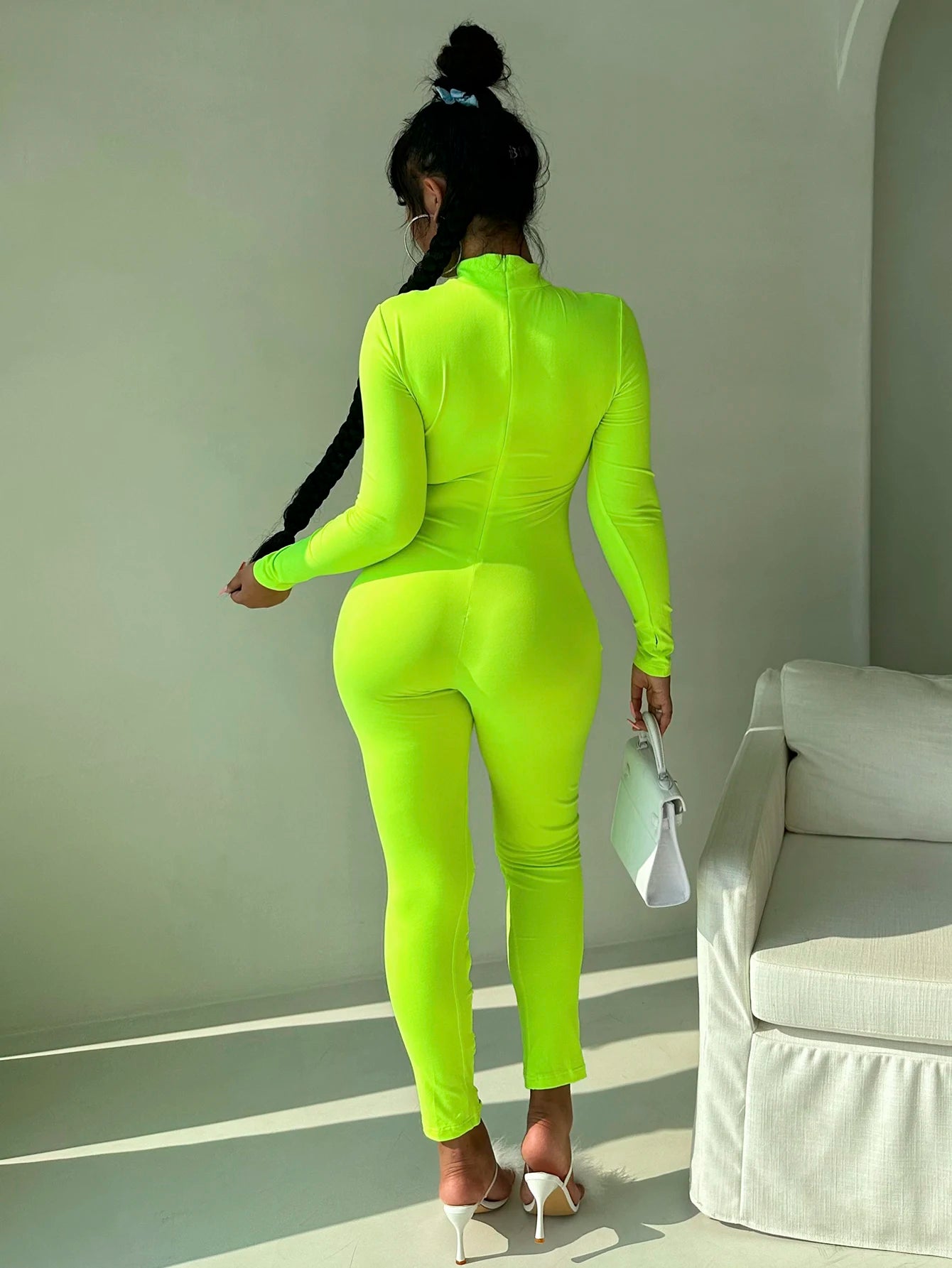 Women's stand up collar tight solid color jumpsuit with metal circle decoration long sleeved all-in-one pants, fitness leggings