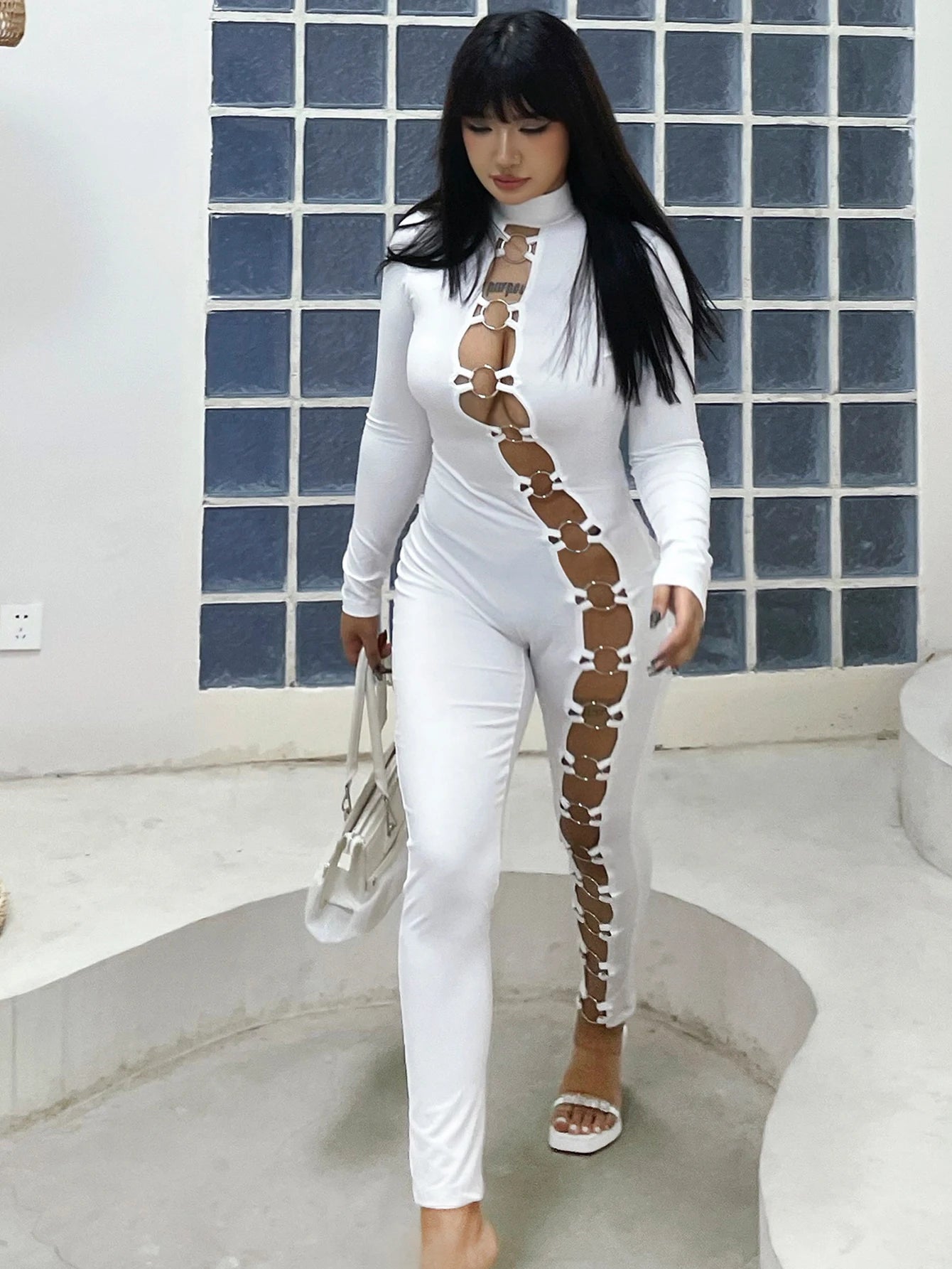 Women's stand up collar tight solid color jumpsuit with metal circle decoration long sleeved all-in-one pants, fitness leggings